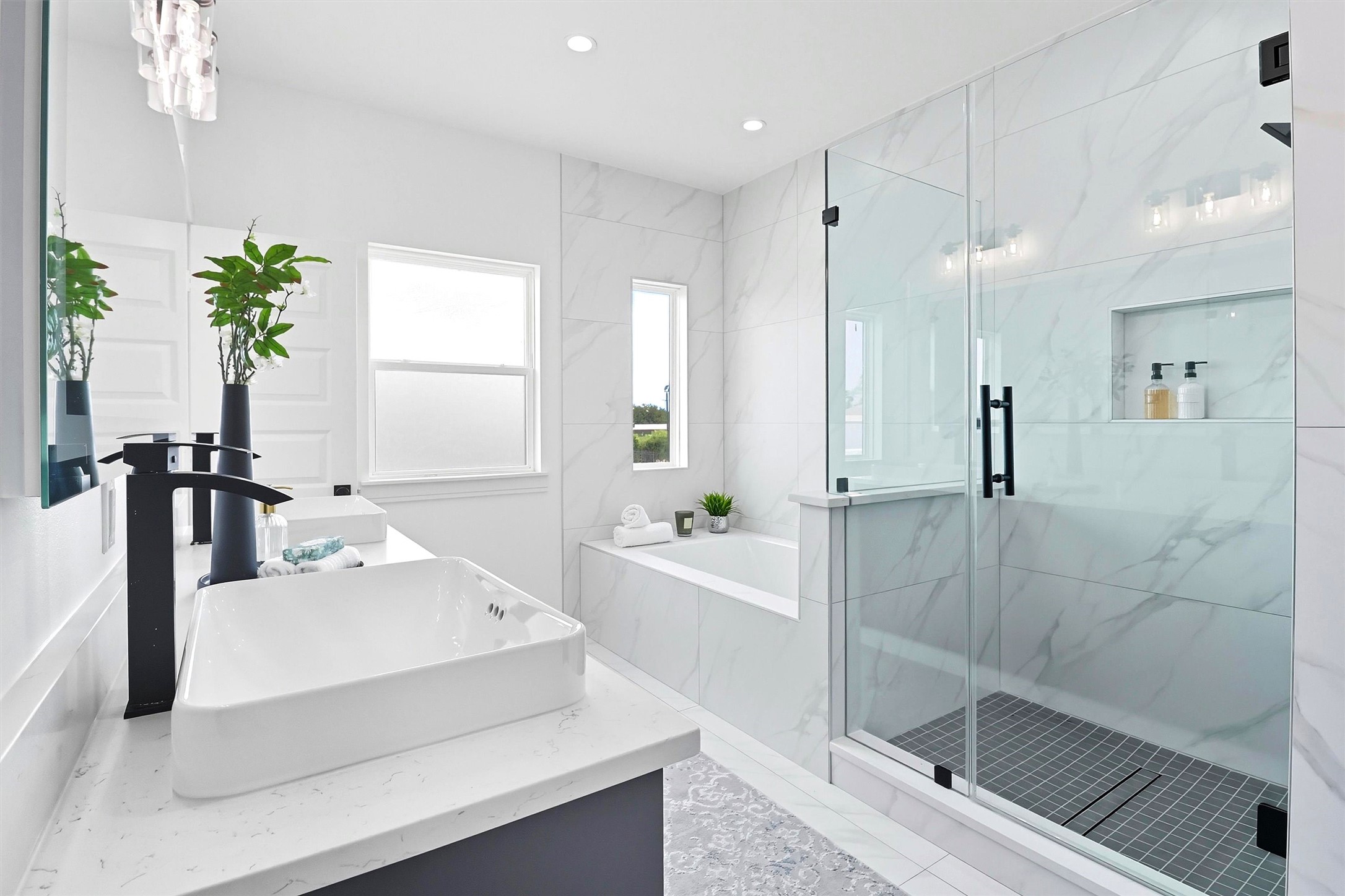 2939 El Fenice Lane Houston, TX 77057 - Photo 9 of 48 a bathroom with a bathtub a sink and a shower