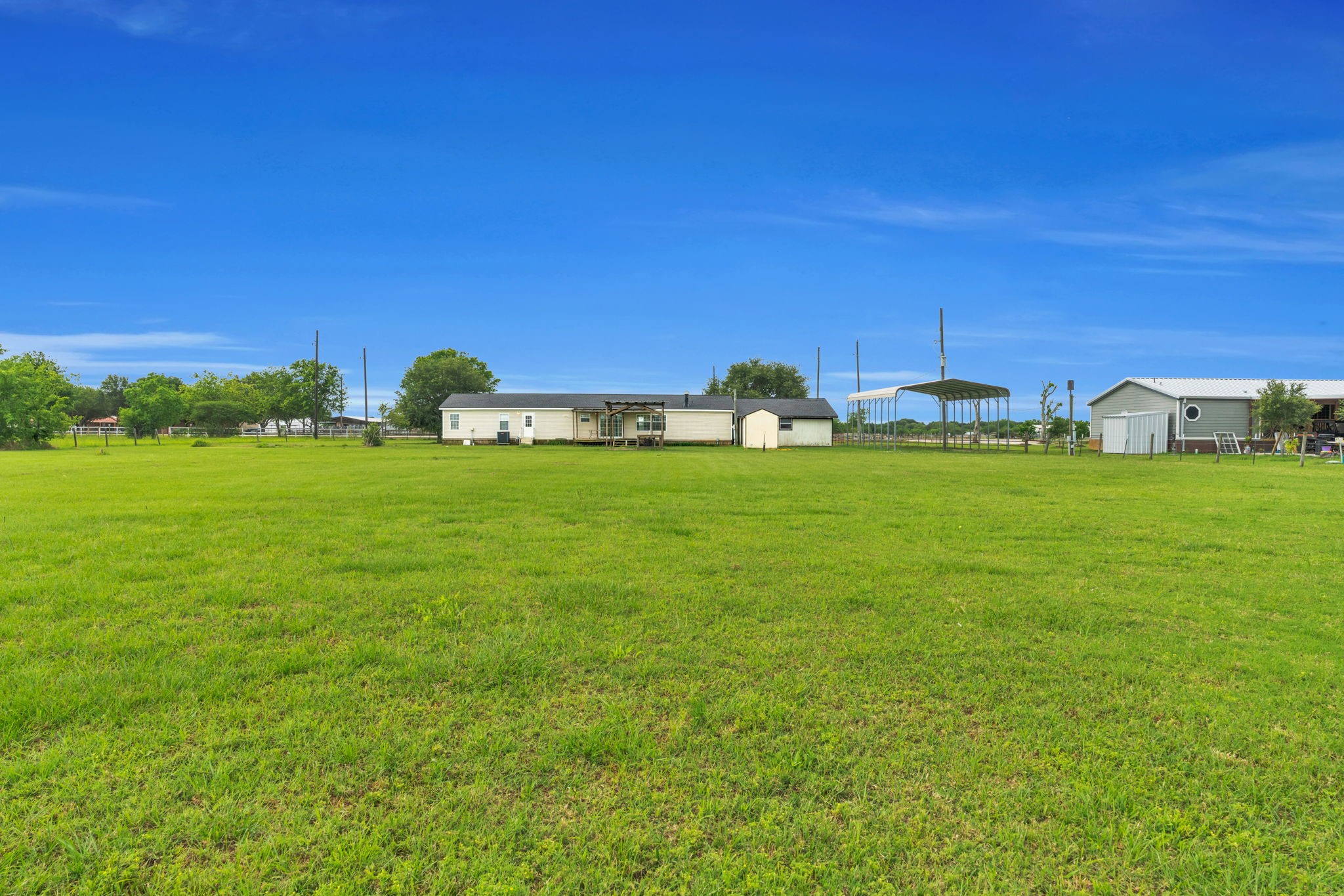 37038 Bell Road Waller, TX 77484 - Photo 30 of 33 a view of a green field with an trees in the background