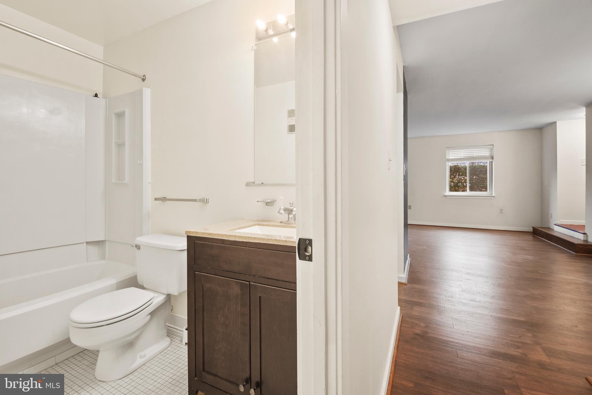 123 West Conway Street, Unit R 58 Baltimore, MD 21201 - Photo 12 of 20 a bathroom with a toilet a sink and a bathtub