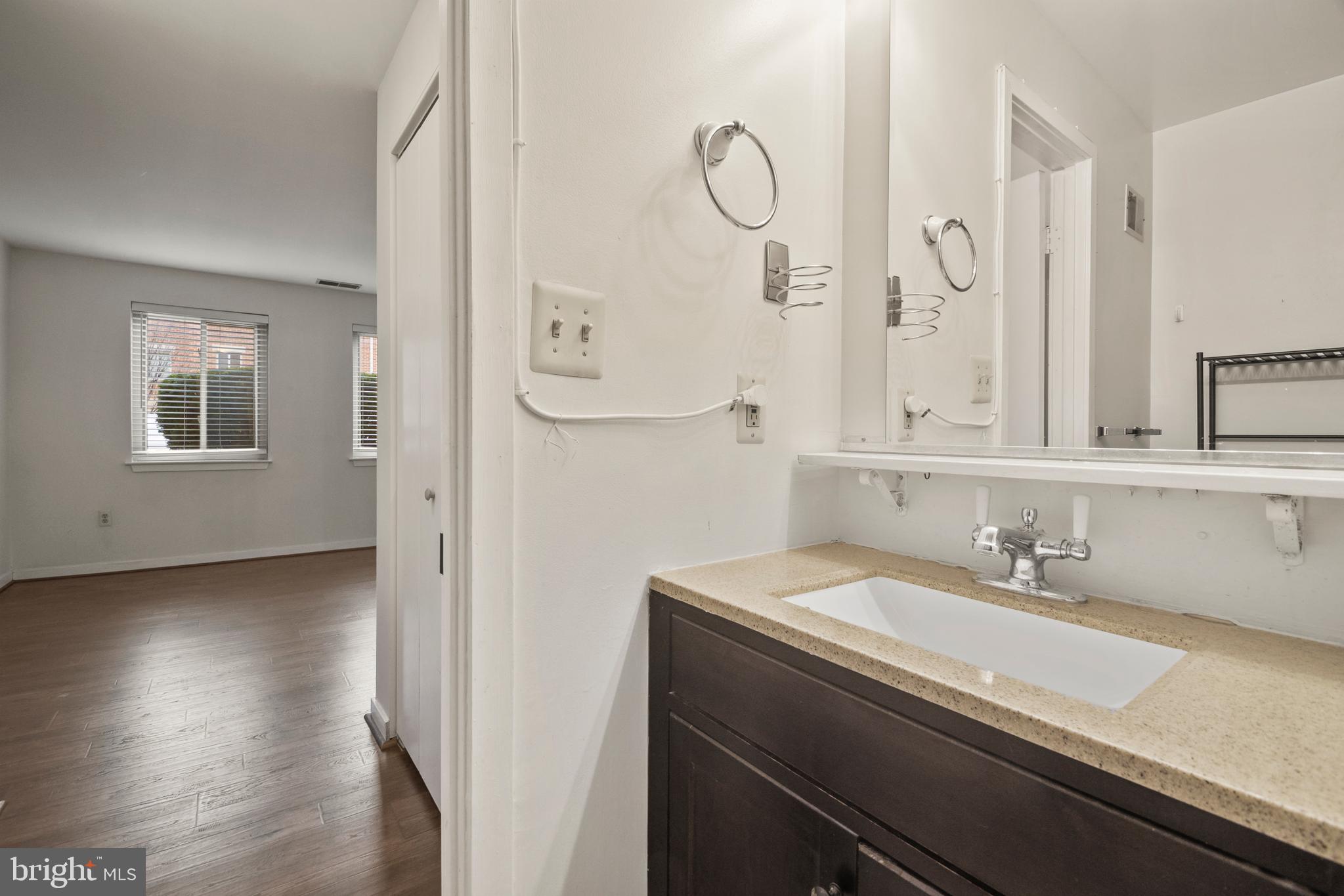123 West Conway Street, Unit R 58 Baltimore, MD 21201 - Photo 17 of 20 a bathroom with a sink and a mirror