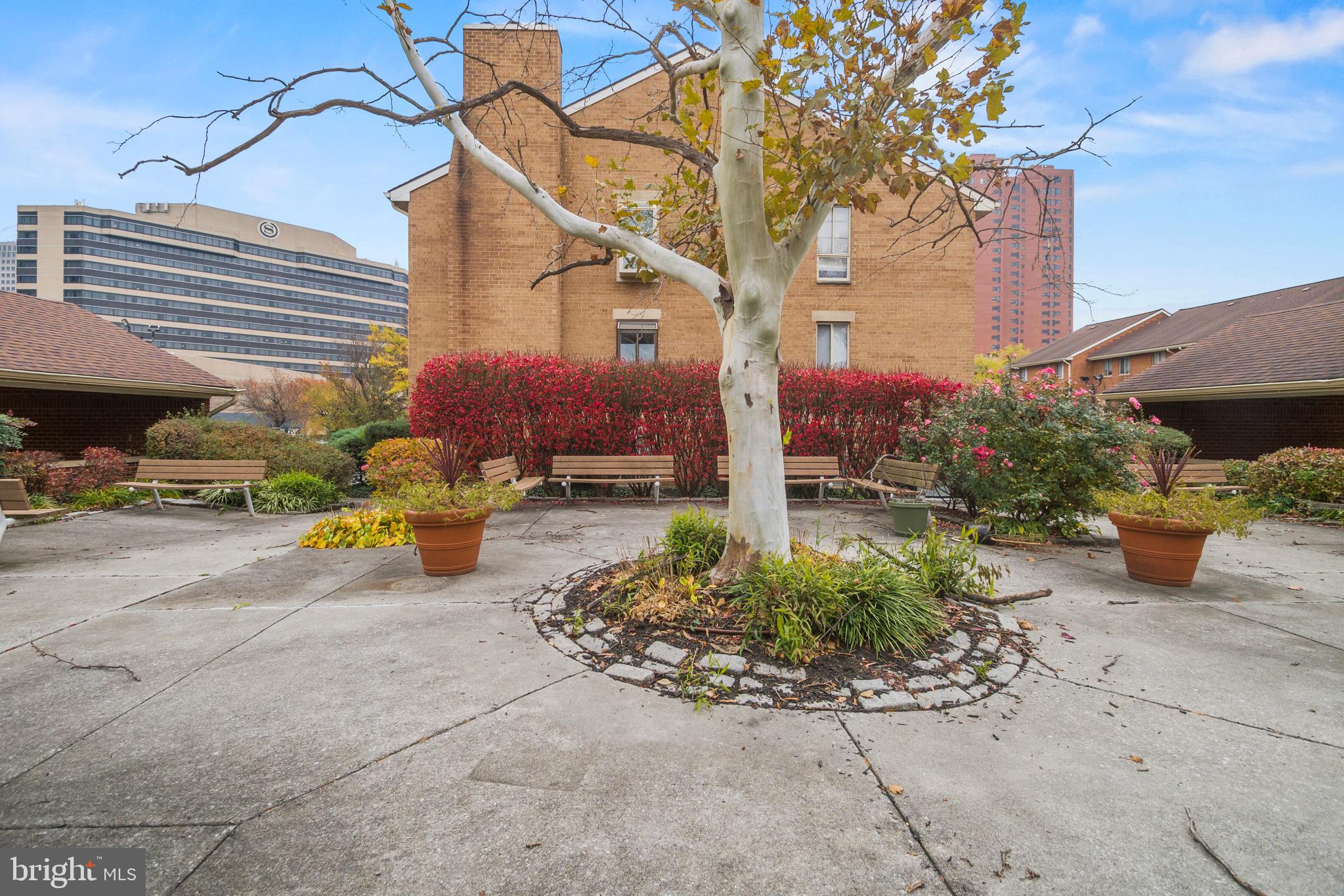 123 West Conway Street, Unit R 58 Baltimore, MD 21201 - Photo 20 of 20 a view of a patio with table and chairs under an umbrella