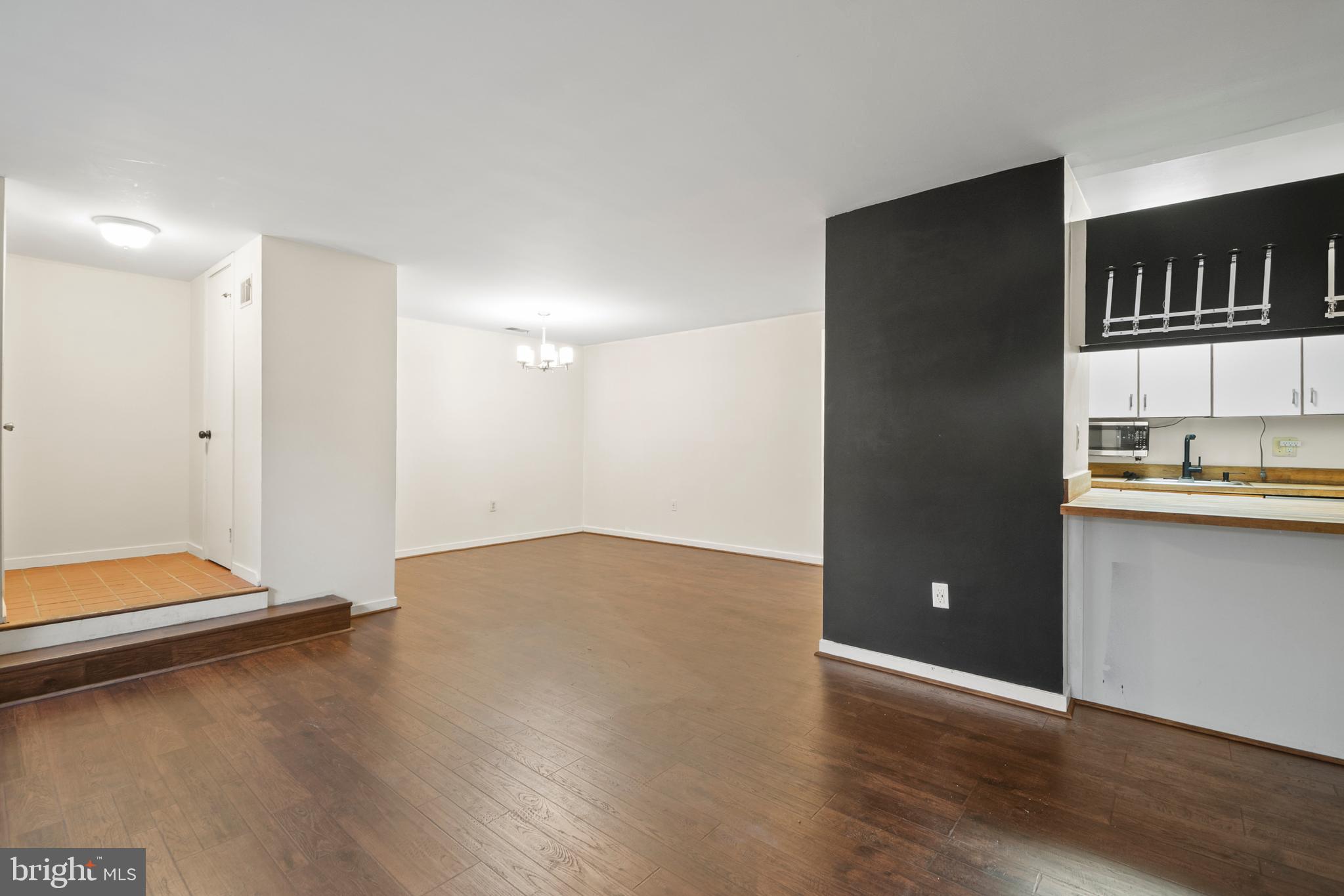 123 West Conway Street, Unit R 58 Baltimore, MD 21201 - Photo 4 of 20 a view of room with window and wooden floor