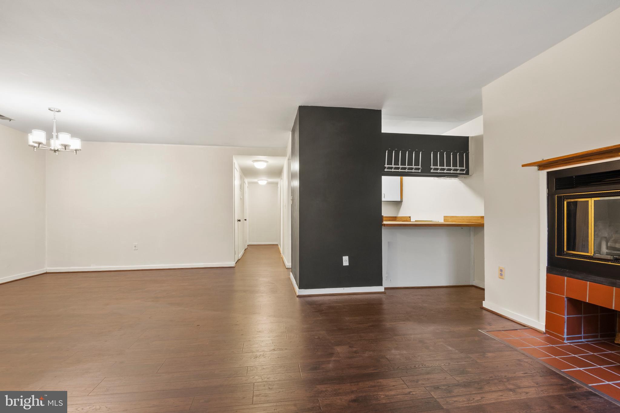 123 West Conway Street, Unit R 58 Baltimore, MD 21201 - Photo 5 of 20 a view of an empty room with kitchen and window