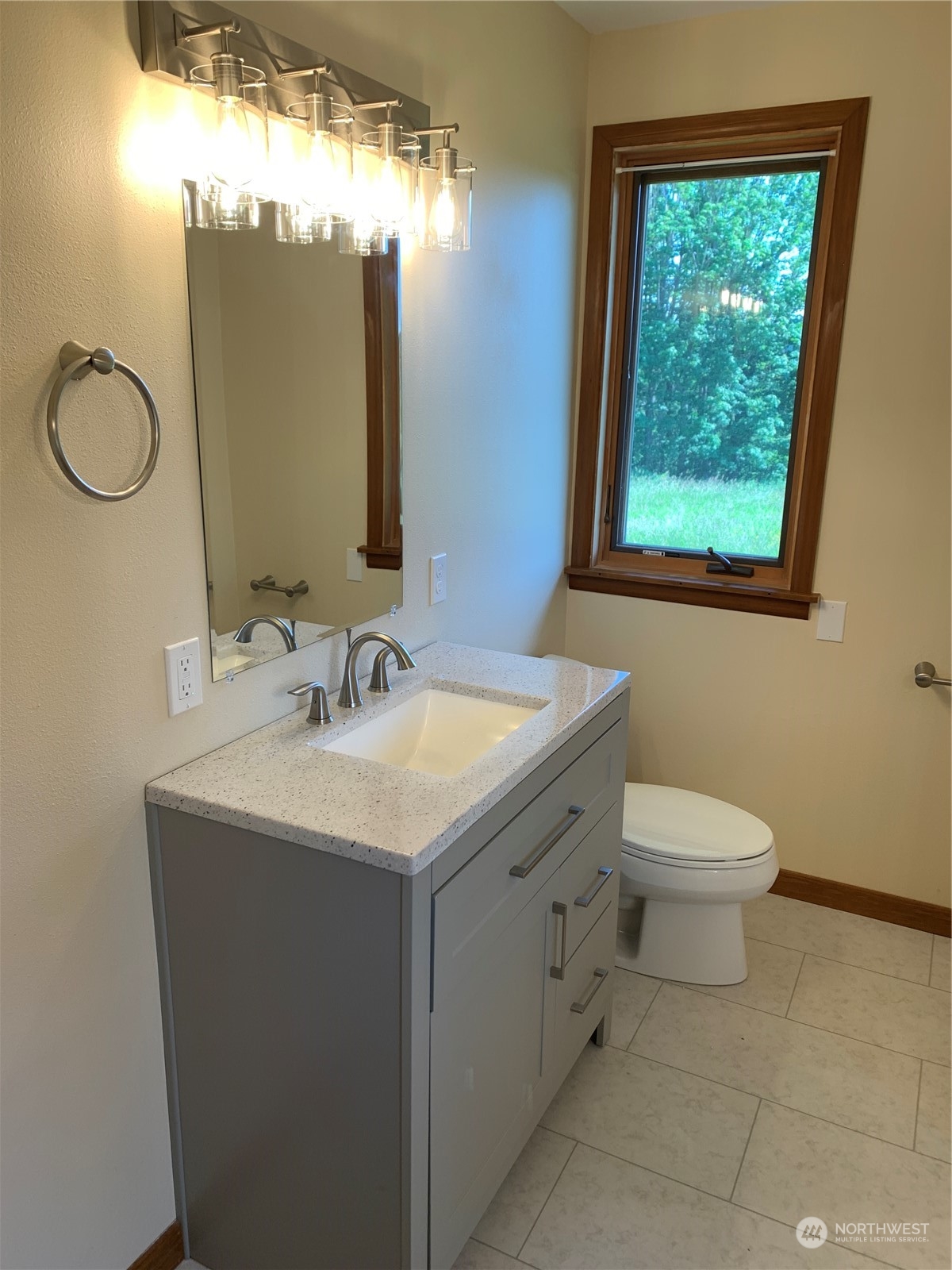 7445 Valley View Road Ferndale, WA 98248 - Photo 14 of 39 a bathroom with a toilet sink and mirror
