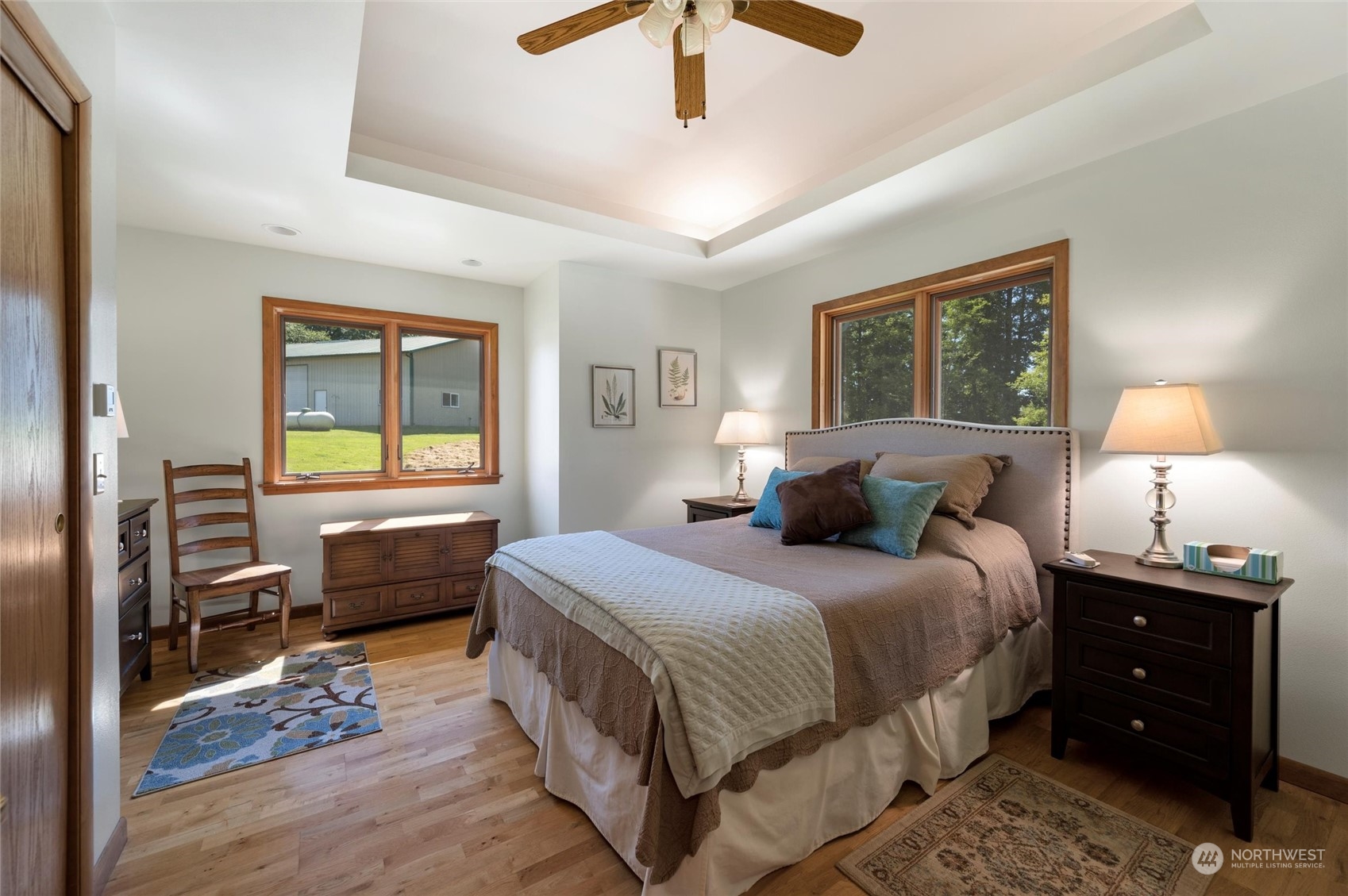 7445 Valley View Road Ferndale, WA 98248 - Photo 19 of 39 a bedroom with a bed and a dresser next to a window