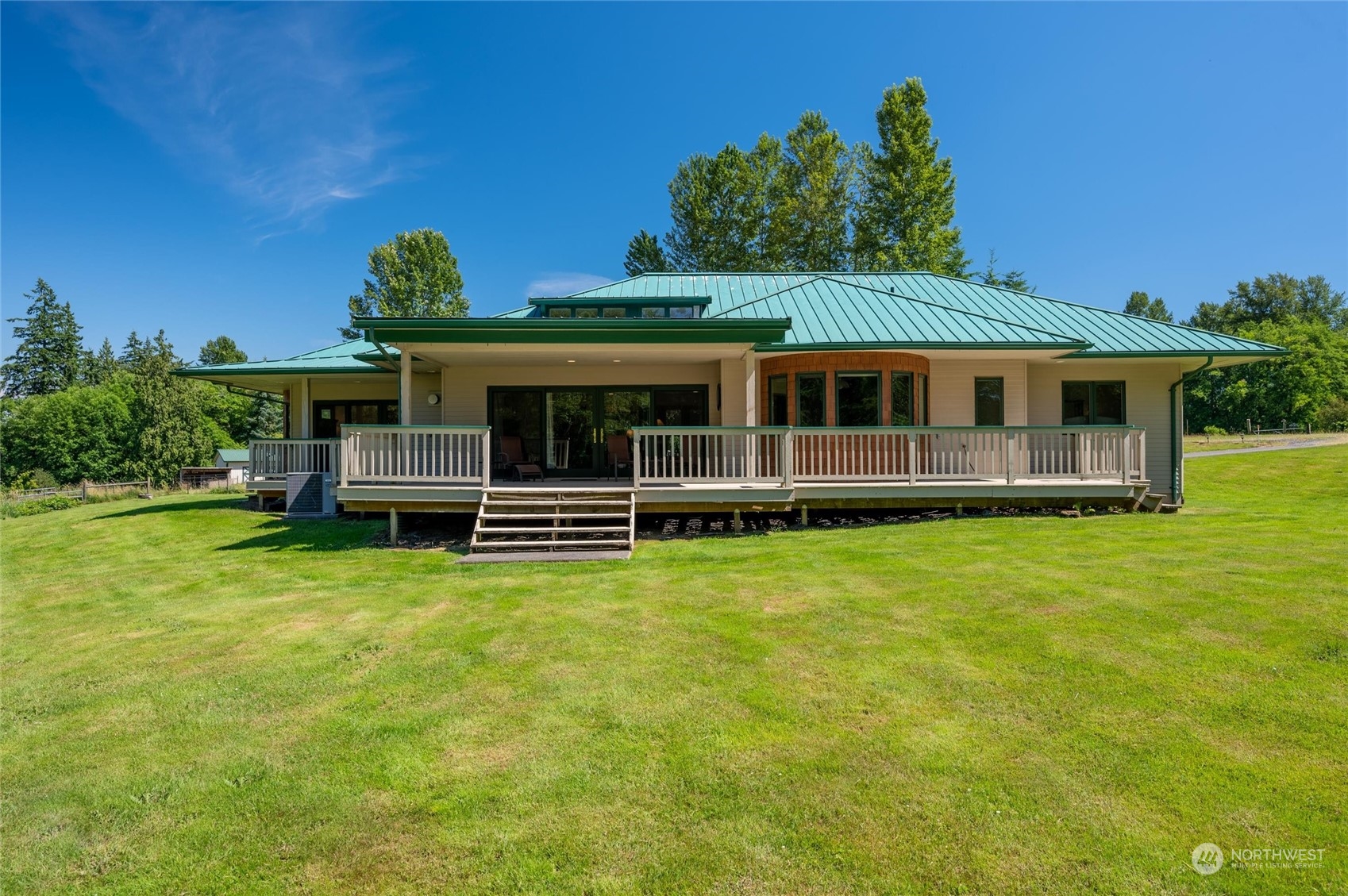 7445 Valley View Road Ferndale, WA 98248 - Photo 21 of 39 a front view of a house with a garden
