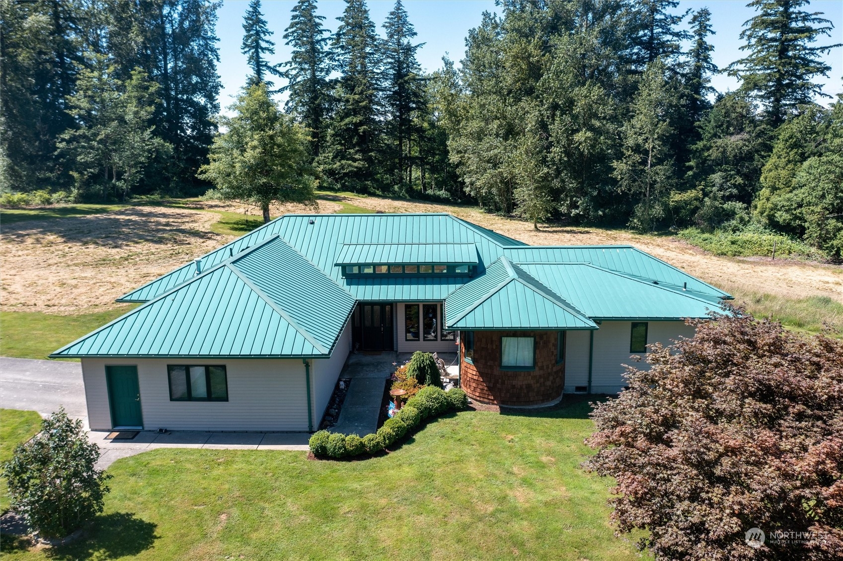 7445 Valley View Road Ferndale, WA 98248 - Photo 3 of 39 a front view of a house with garden
