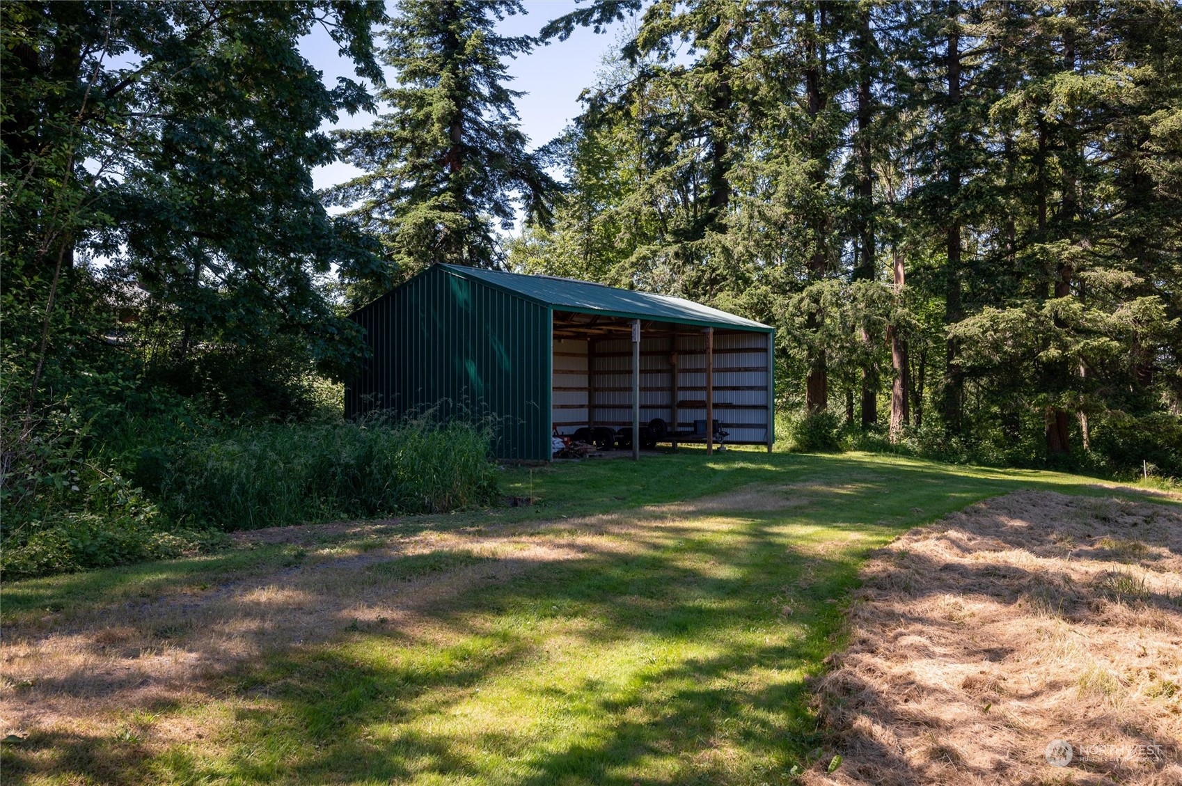 7445 Valley View Road Ferndale, WA 98248 - Photo 37 of 39 a view of a backyard with a large tree