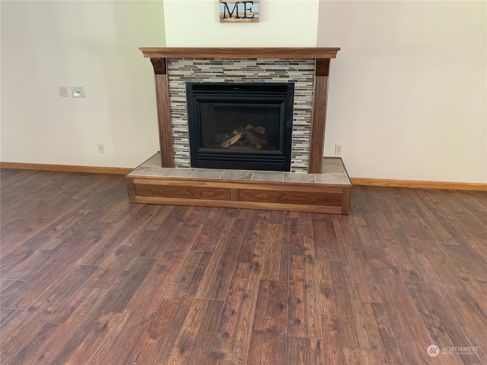 7445 Valley View Road Ferndale, WA 98248 - Photo 39 of 39 an empty room with wooden floor fireplace