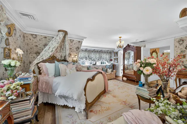 a bed room with a bed and a chair