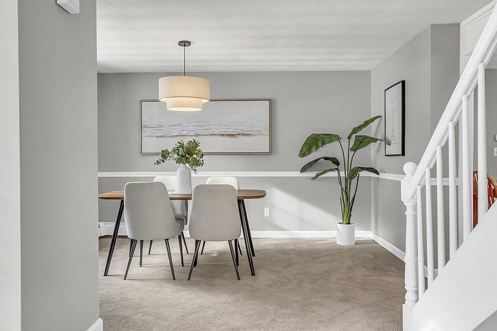 25 Ansie Road Chelmsford, MA 01824 - Photo 17 of 41 a dining room with furniture and chandelier
