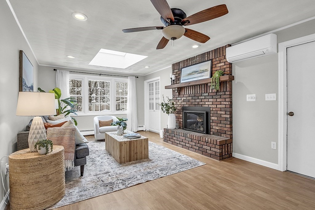 25 Ansie Road Chelmsford, MA 01824 - Photo 2 of 41 a living room with furniture and a fireplace