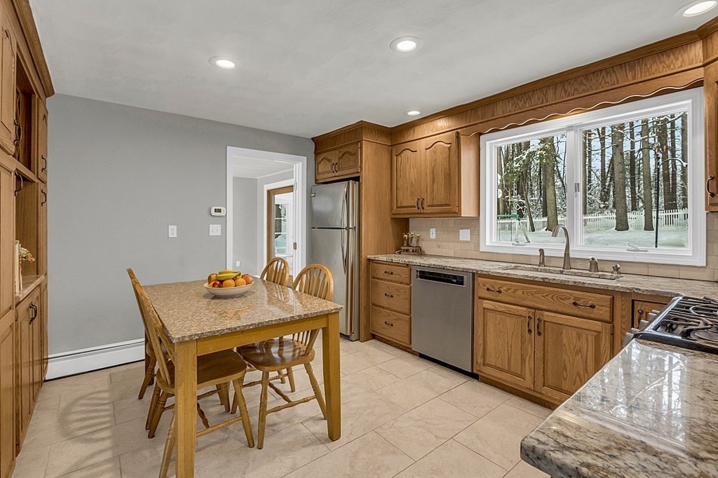 25 Ansie Road Chelmsford, MA 01824 - Photo 22 of 41 a kitchen with a stove a sink and a refrigerator