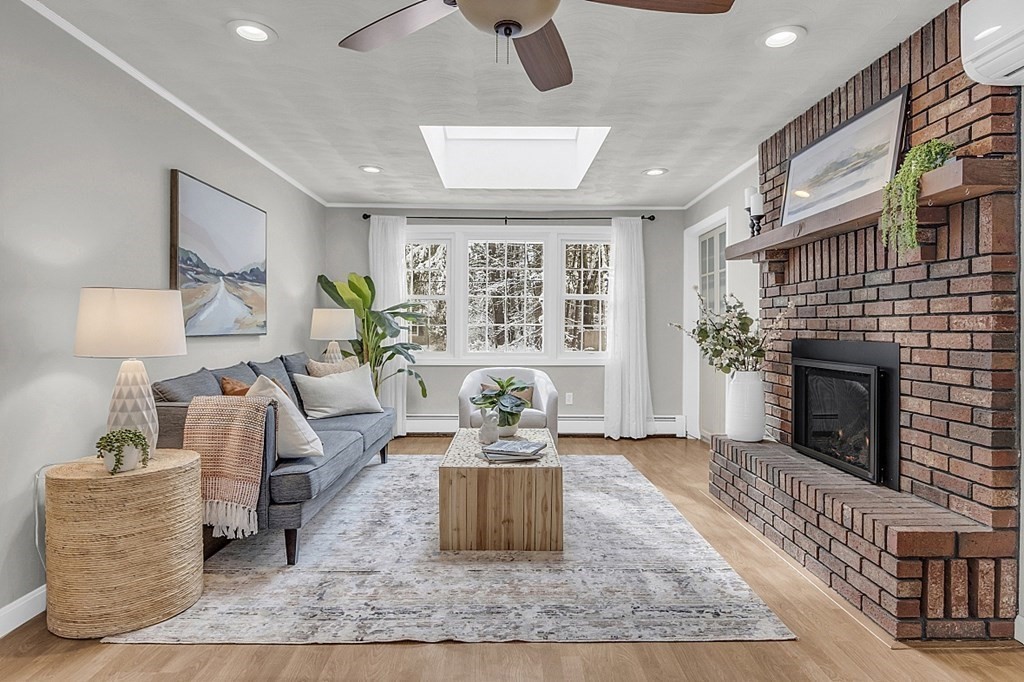 25 Ansie Road Chelmsford, MA 01824 - Photo 23 of 41 a living room with furniture and a fireplace