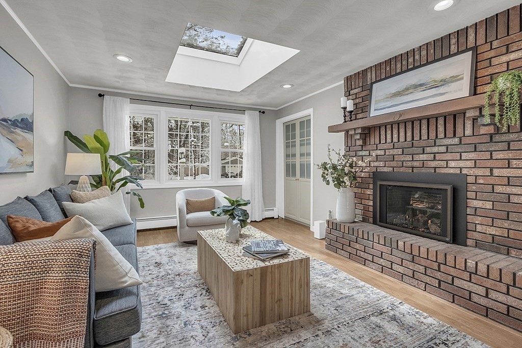 25 Ansie Road Chelmsford, MA 01824 - Photo 25 of 41 a living room with furniture and a fireplace