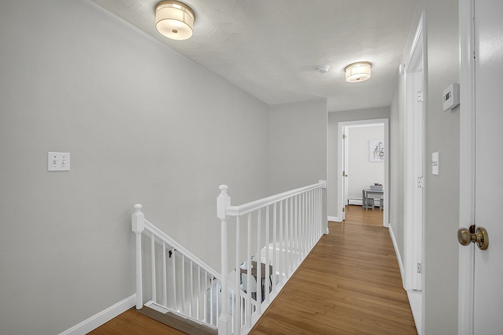 25 Ansie Road Chelmsford, MA 01824 - Photo 31 of 41 a view of a hallway with wooden floor