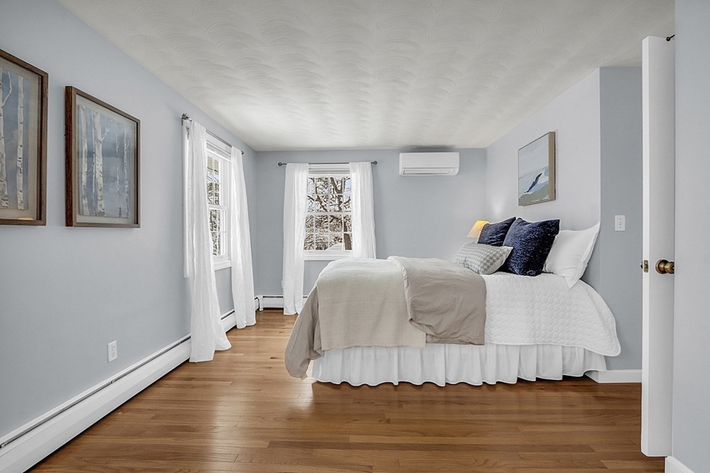 25 Ansie Road Chelmsford, MA 01824 - Photo 33 of 41 a bedroom with a bed and wooden floor