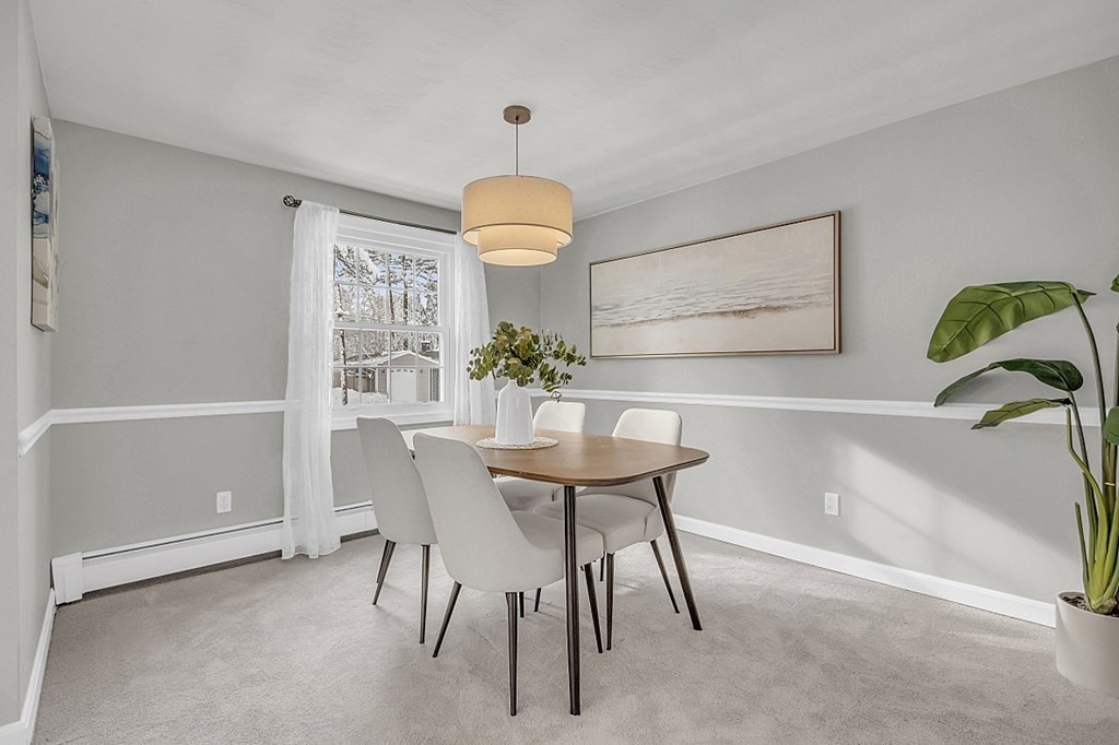 25 Ansie Road Chelmsford, MA 01824 - Photo 4 of 41 a view of a dining room with furniture and a chandelier