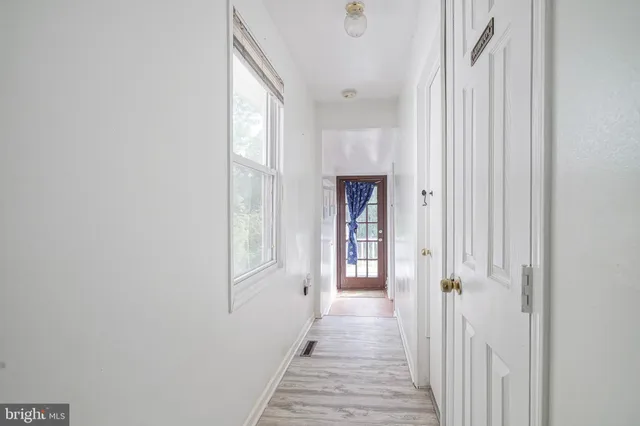 a white toilet sitting next to a shower curtain