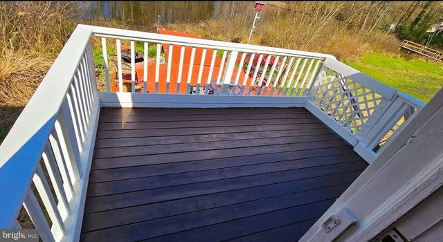 a view of a yard with wooden floor