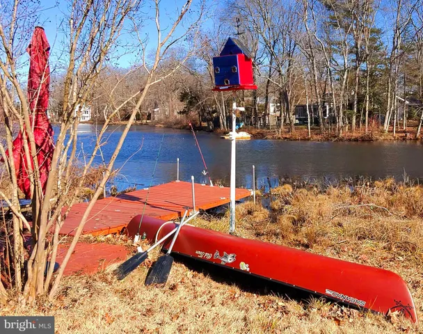 a view of a lake with a yard