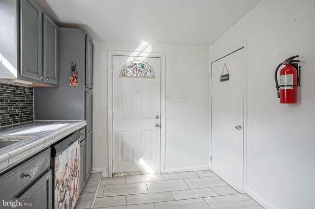 a kitchen with stainless steel appliances granite countertop a sink and a stove