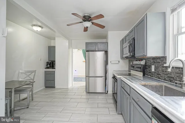 a kitchen with refrigerator cabinets and counter space