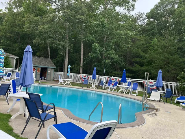 a view of a chairs and table in a patio