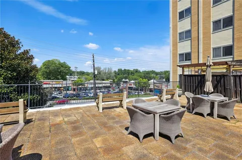 a view of a terrace with sitting area