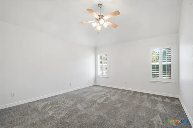 a spacious bathroom with a double vanity sink mirror and double