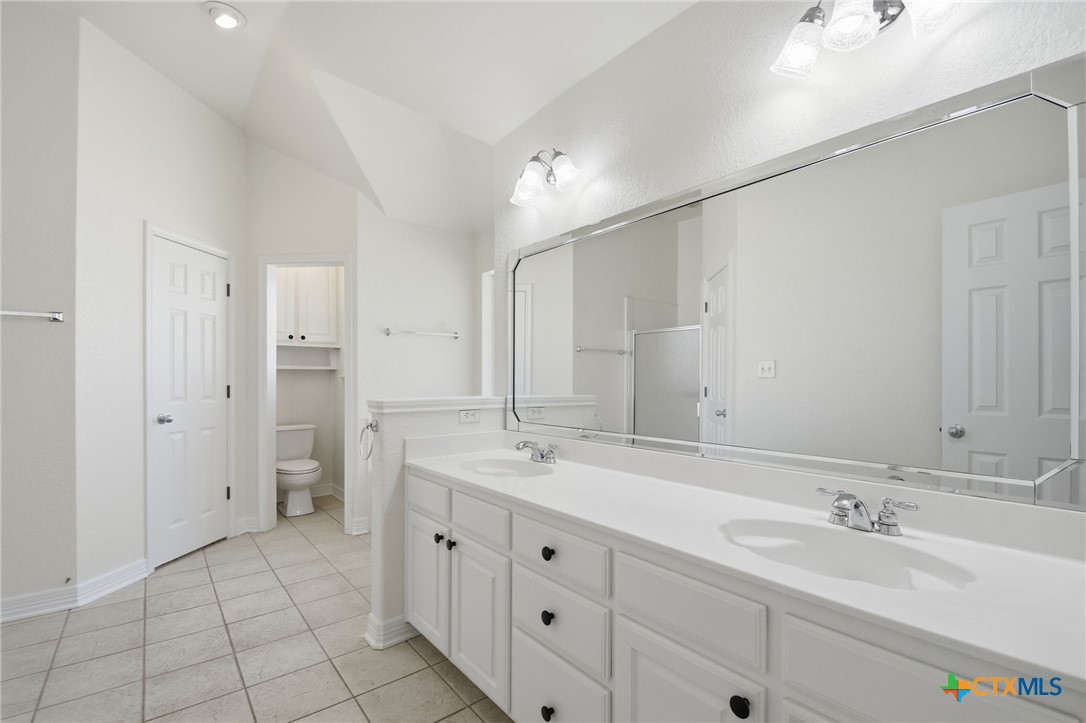 4703 Sunflower Lane Temple, TX 76502 - Photo 18 of 35 a spacious bathroom with a double vanity sink mirror and double