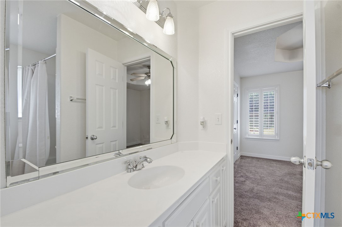 4703 Sunflower Lane Temple, TX 76502 - Photo 25 of 35 a bathroom with a sink and a mirror