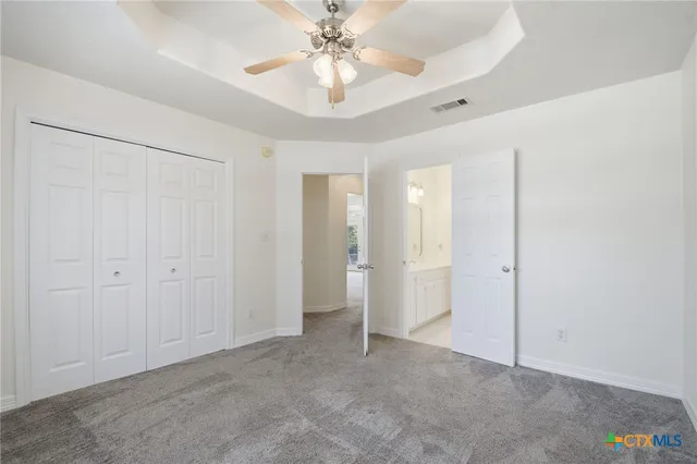 a white toilet sitting next to a bath tub