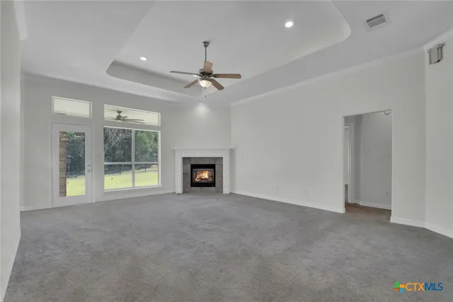 a kitchen with a refrigerator sink and cabinets