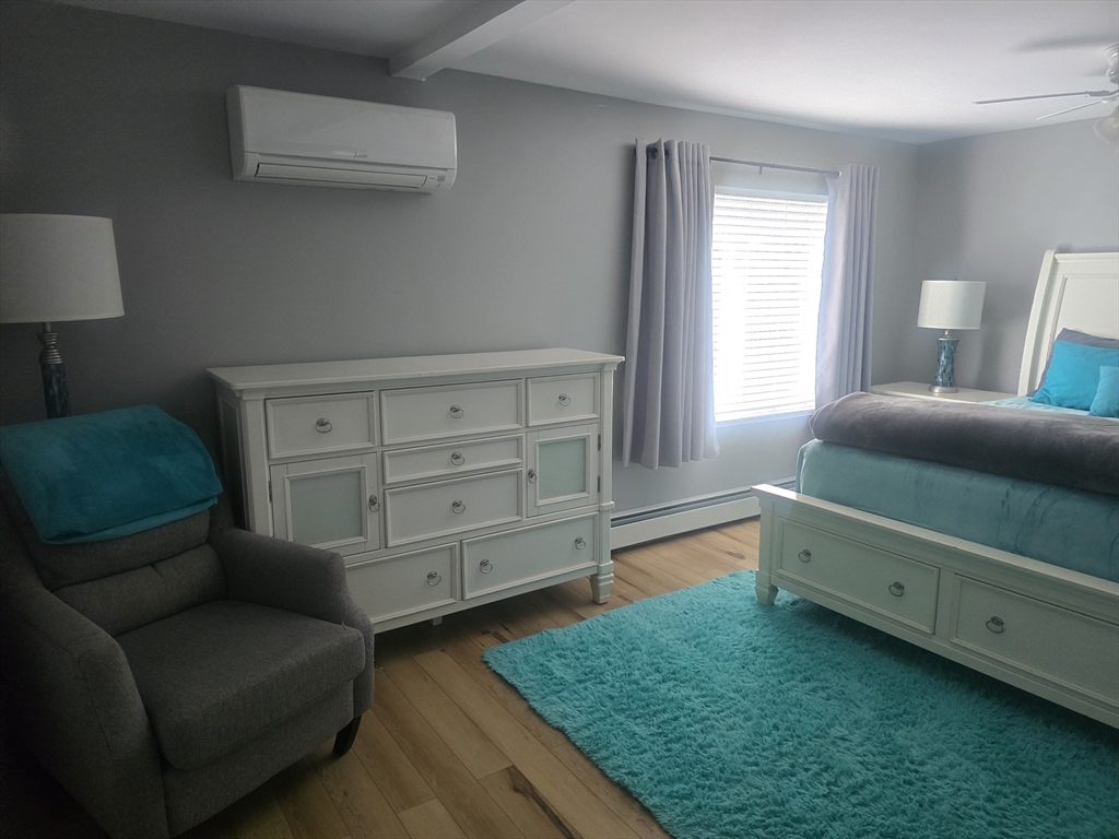 855 Somers Road East Longmeadow, MA 01028 - Photo 1 of 10 a bedroom with a bed and a dresser