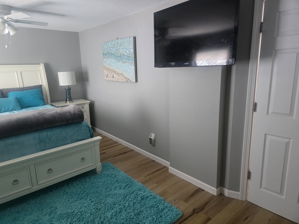 855 Somers Road East Longmeadow, MA 01028 - Photo 3 of 10 a living room with furniture and a flat screen tv