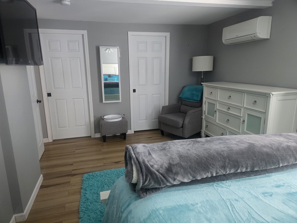 855 Somers Road East Longmeadow, MA 01028 - Photo 5 of 10 a bedroom with a bed and wooden floor