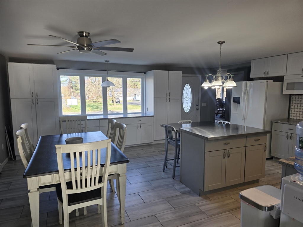 855 Somers Road East Longmeadow, MA 01028 - Photo 7 of 10 a dining room with furniture a chandelier and window