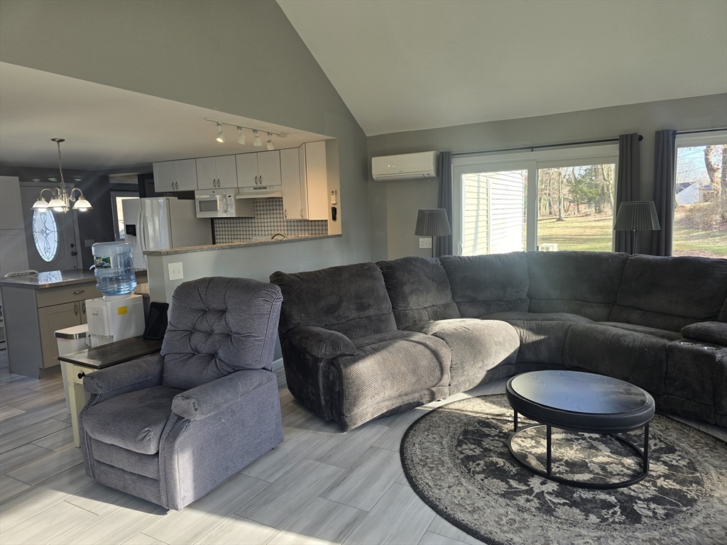 855 Somers Road East Longmeadow, MA 01028 - Photo 10 of 10 a living room with furniture and a large window