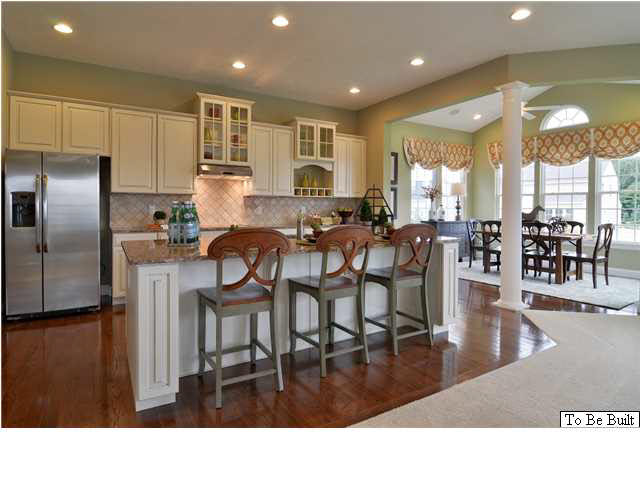 323 Ridgemont Road Ruckersville, VA 22968 - Photo 4 of 14 a kitchen with stainless steel appliances granite countertop a dining table chairs and granite counter tops