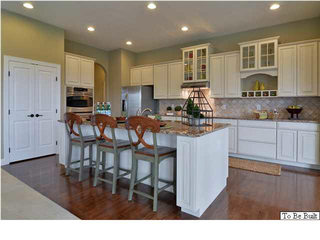 323 Ridgemont Road Ruckersville, VA 22968 - Photo 5 of 14 a kitchen with stainless steel appliances granite countertop a stove top oven a sink a dining table and chairs