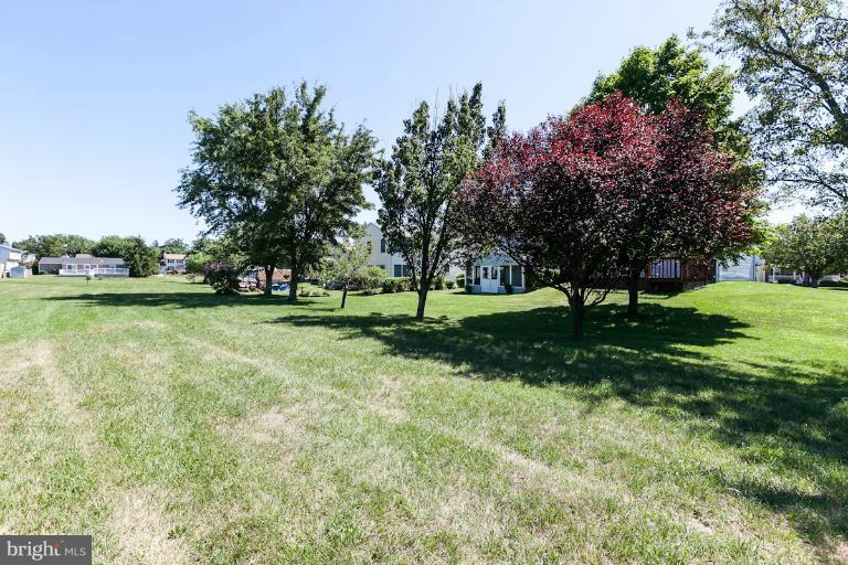 9106 Bowline Road Baltimore, MD 21236 - Photo 14 of 30 a view of a park with large trees