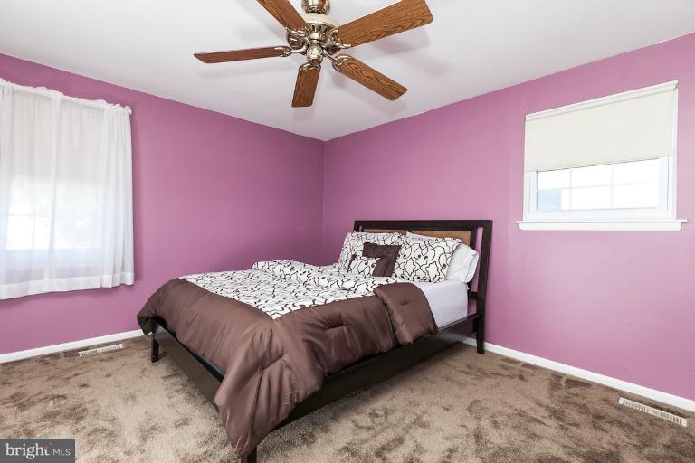9106 Bowline Road Baltimore, MD 21236 - Photo 8 of 30 a bedroom with a bed and a window