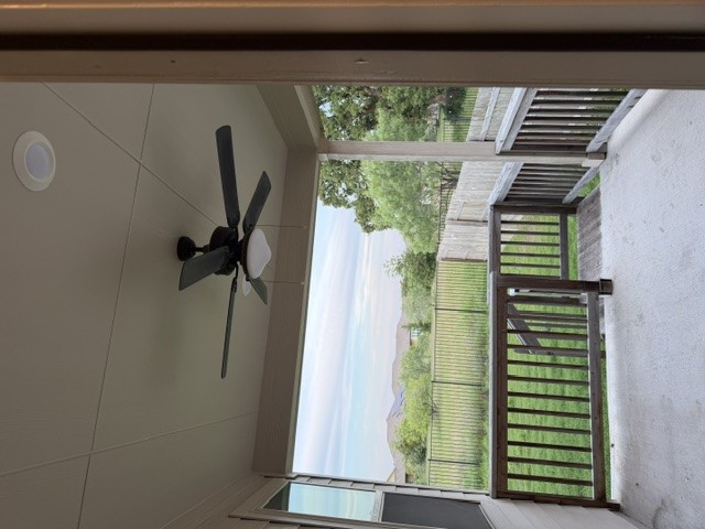 2016 Wooded Run Trail Georgetown, TX 78628 - Photo 14 of 16 Covered patio featuring a ceiling fan with integrated lighting, recessed lighting, and a wood railing