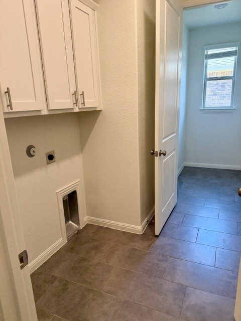 2016 Wooded Run Trail Georgetown, TX 78628 - Photo 8 of 16 Laundry area featuring white shaker-style cabinetry, a dryer vent, and plumbing hookups