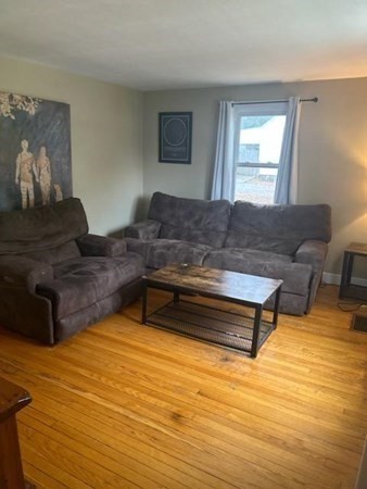 179 Powell Avenue Springfield, MA 01118 - Photo 12 of 30 a living room with furniture and a wooden floor