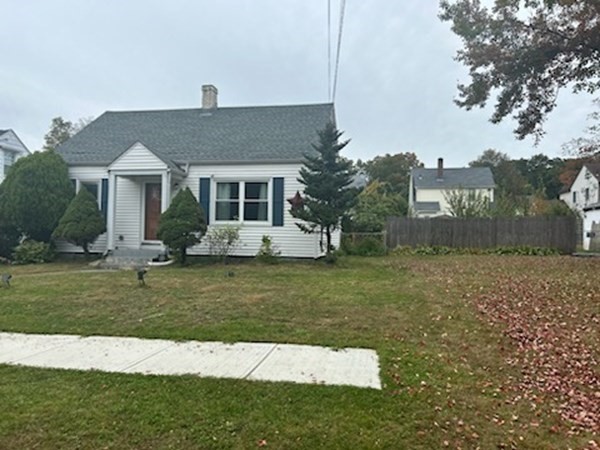 179 Powell Avenue Springfield, MA 01118 - Photo 3 of 30 a front view of a house with a garden and plants
