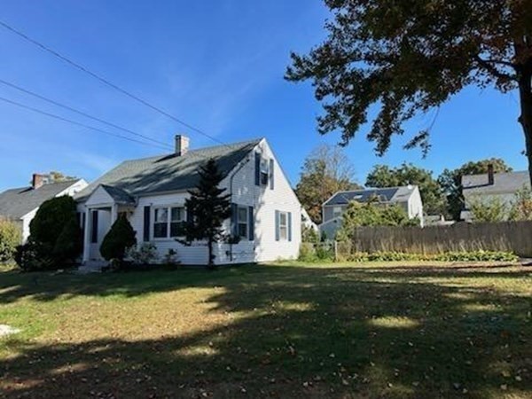 179 Powell Avenue Springfield, MA 01118 - Photo 4 of 30 a view of a house with a big yard