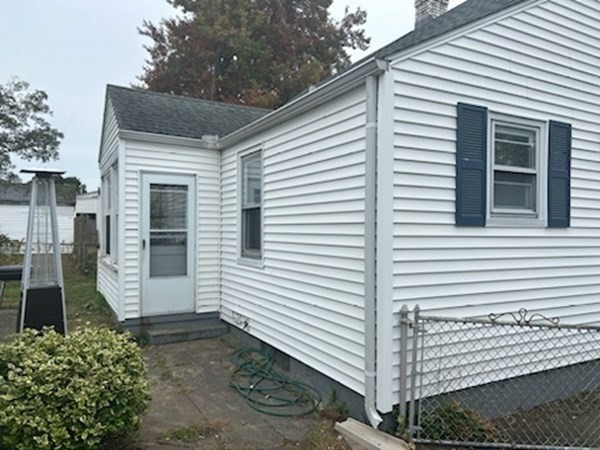 179 Powell Avenue Springfield, MA 01118 - Photo 6 of 30 a view of a white house with a large windows