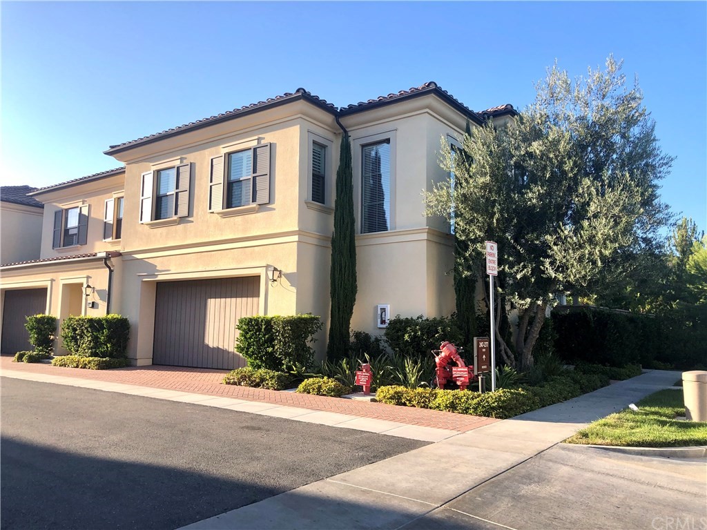 279 Rodeo Irvine, CA 92602 - Photo 1 of 1 a front view of a house with a yard and a garage
